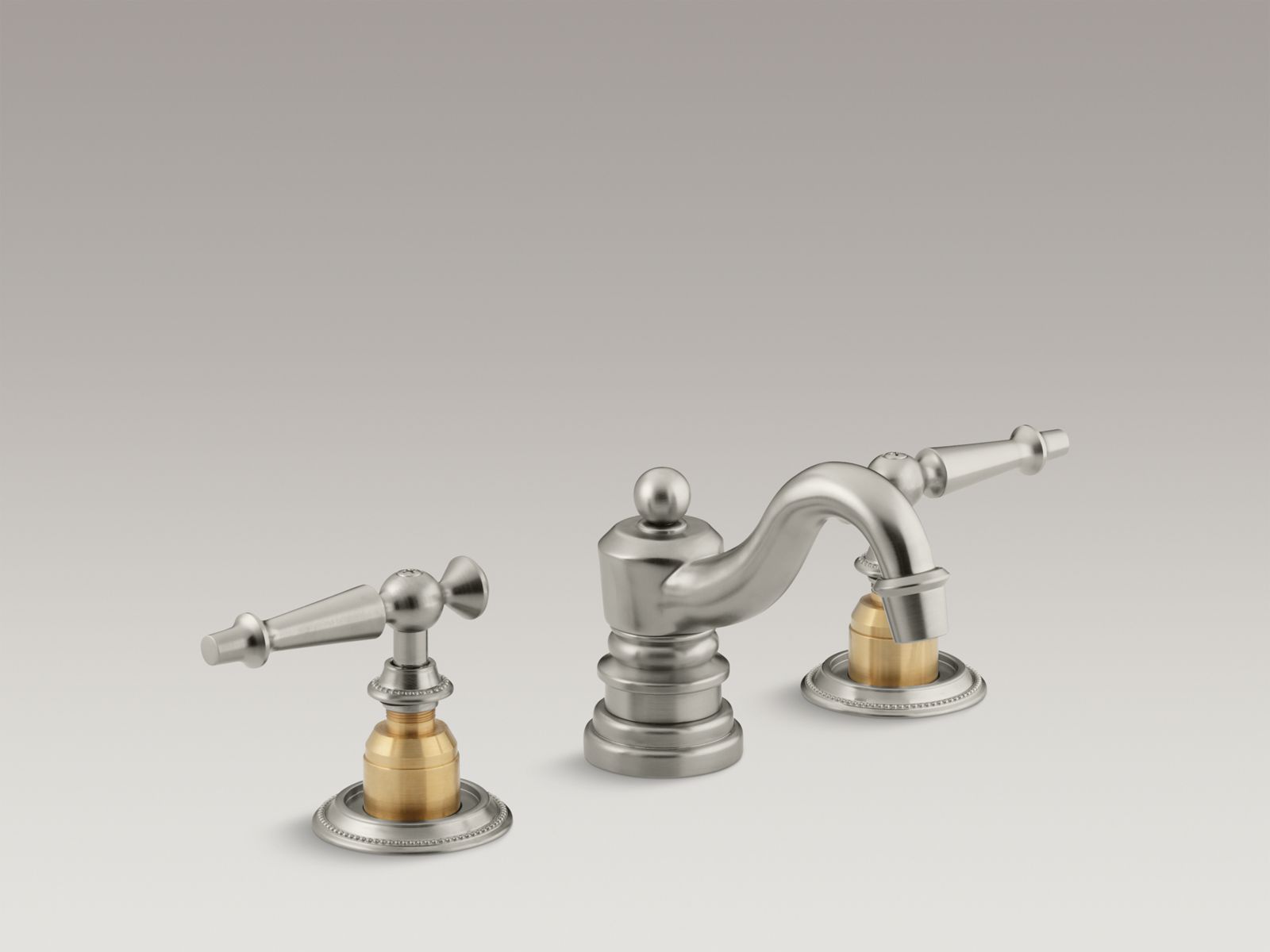 Antique widespread bathroom sink faucet with lever handles, requires ceramic skirts