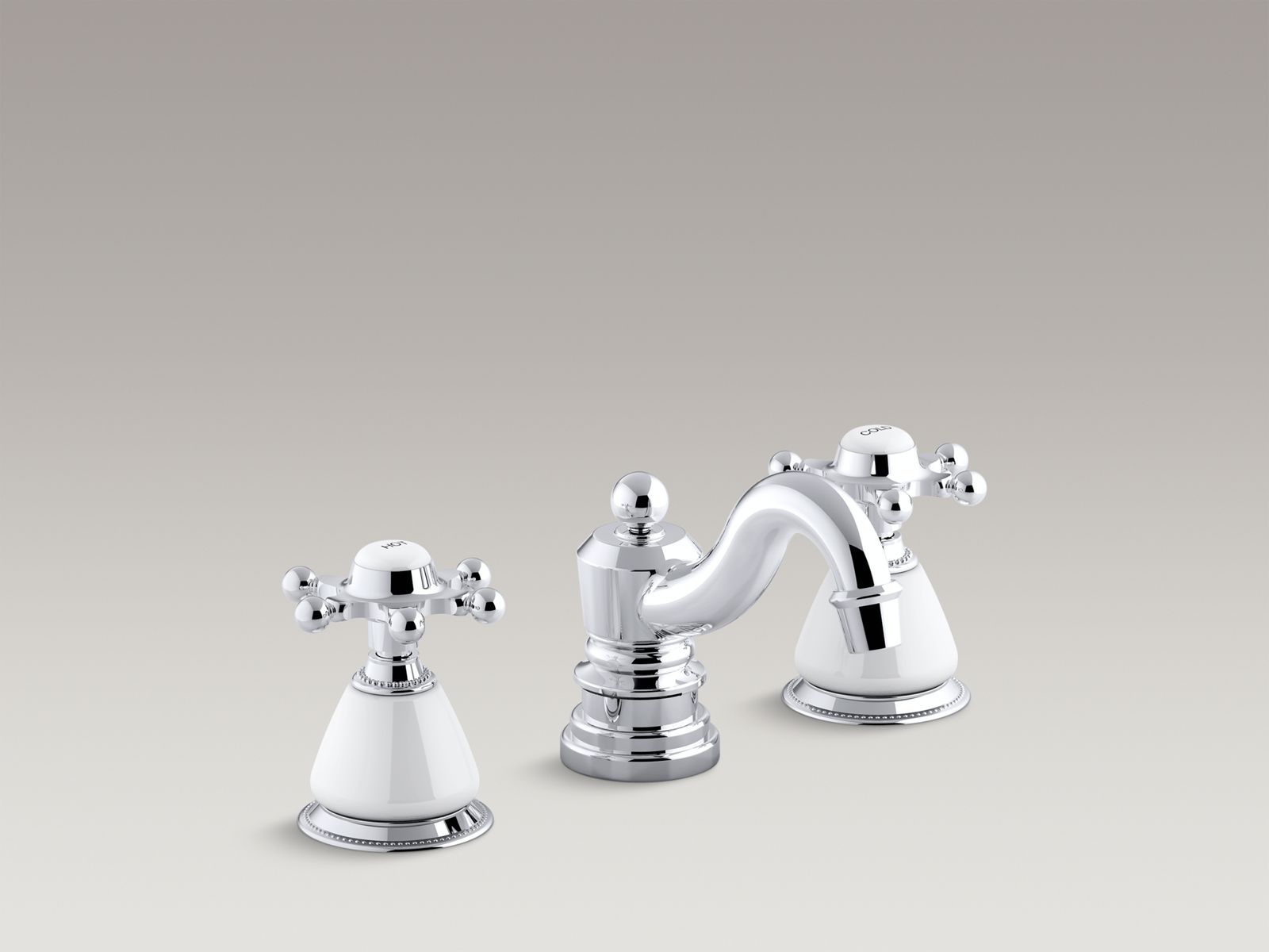 Antique widespread bathroom sink faucet with 6-prong handles and ceramic skirts
