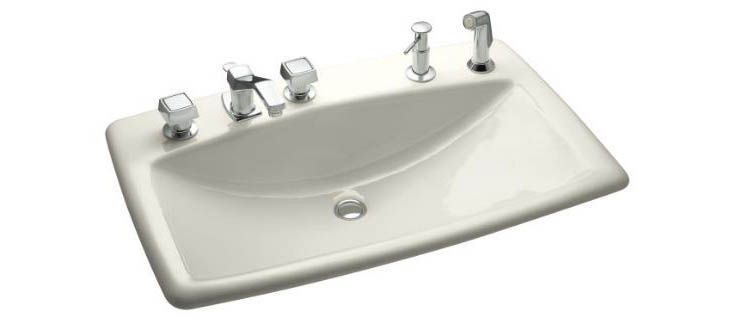 Man's Lav(TM) self-rimming lavatory with 8" centers at left