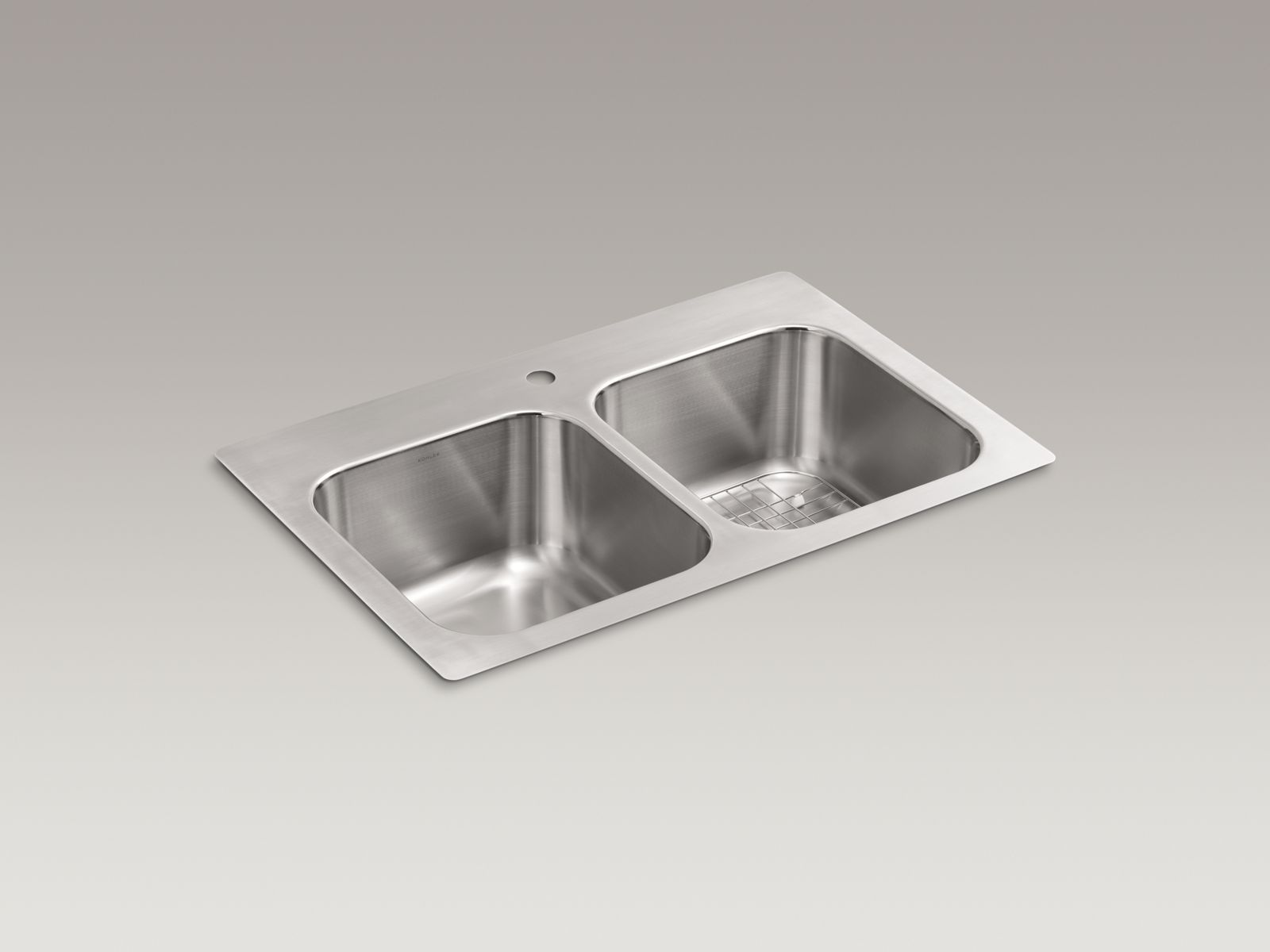 Eventide® 33-3/8" x 22-3/8" x 8-3/4" top-mount/undermount double-equal kitchen sink with rack and single faucet drilling