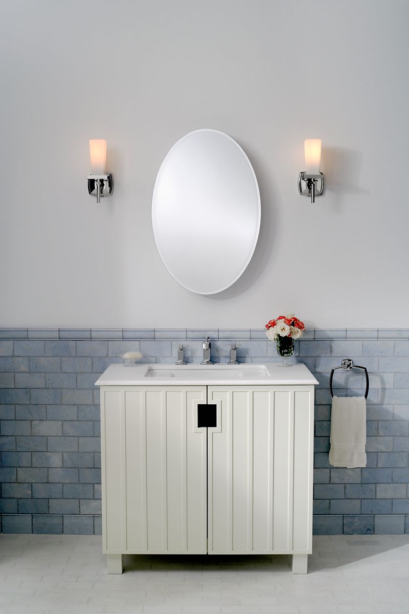20" W x 31" H plastic single-door medicine cabinet with oval mirrored door