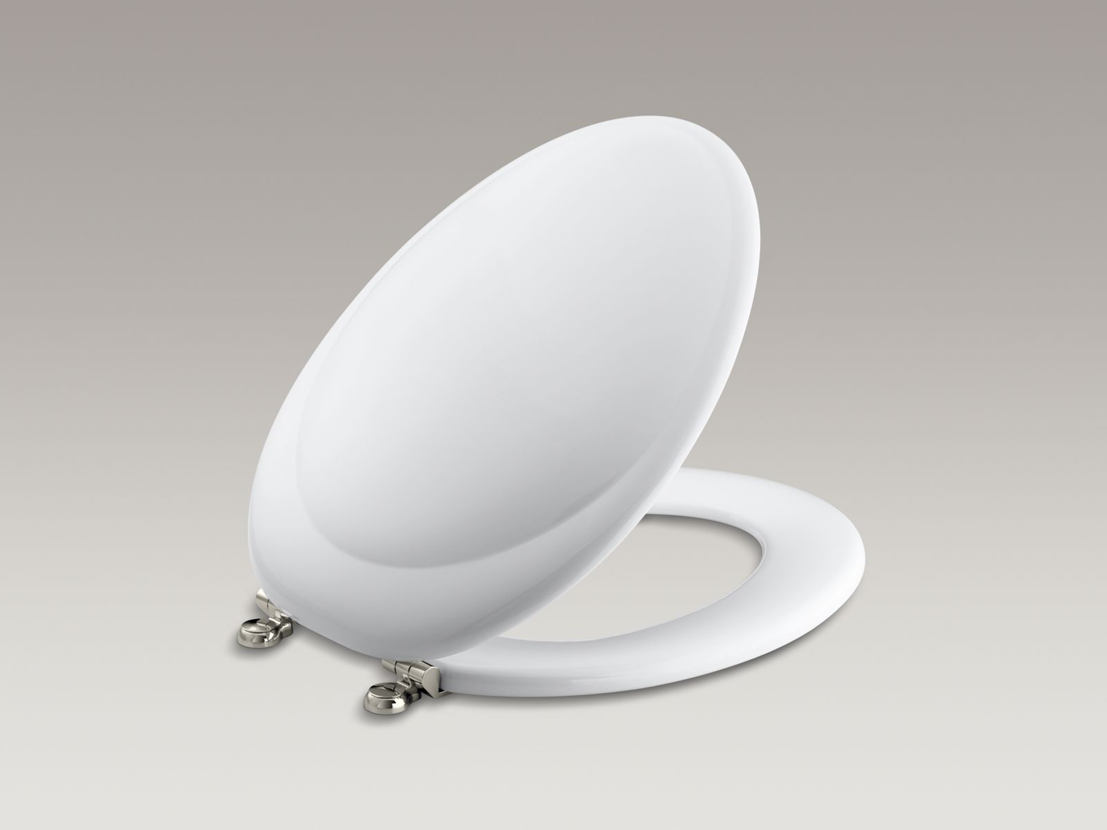 Revival(R) elongated toilet seat with Vibrant(R) Polished Nickel hinges