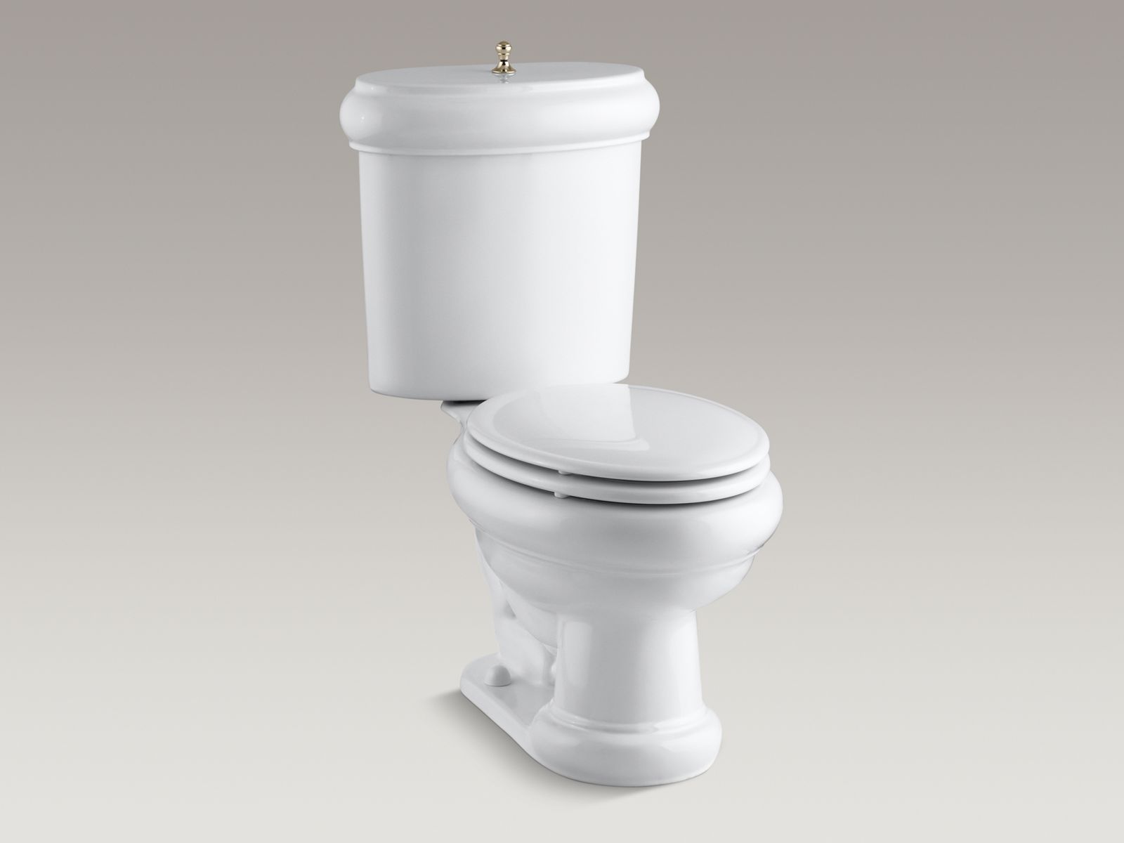 Revival(R) two-piece elongated 1.6 GPF rim toilet with seat, Vibrant(R) French Gold flush actuator and trim, and Insuliner(R) tank liner