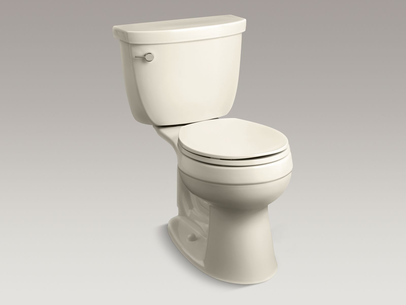 Cimarron(R) Comfort Height(R) two-piece round-front 1.6 gpf toilet with left-hand trip lever, less seat